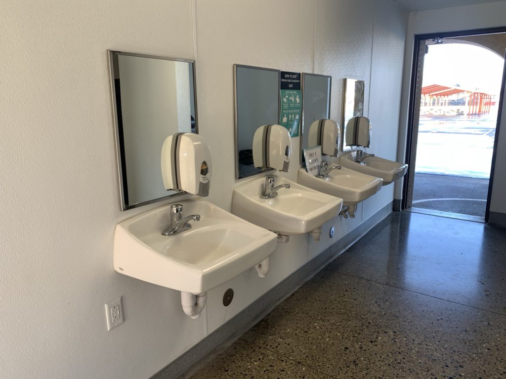 row of restroom sinks